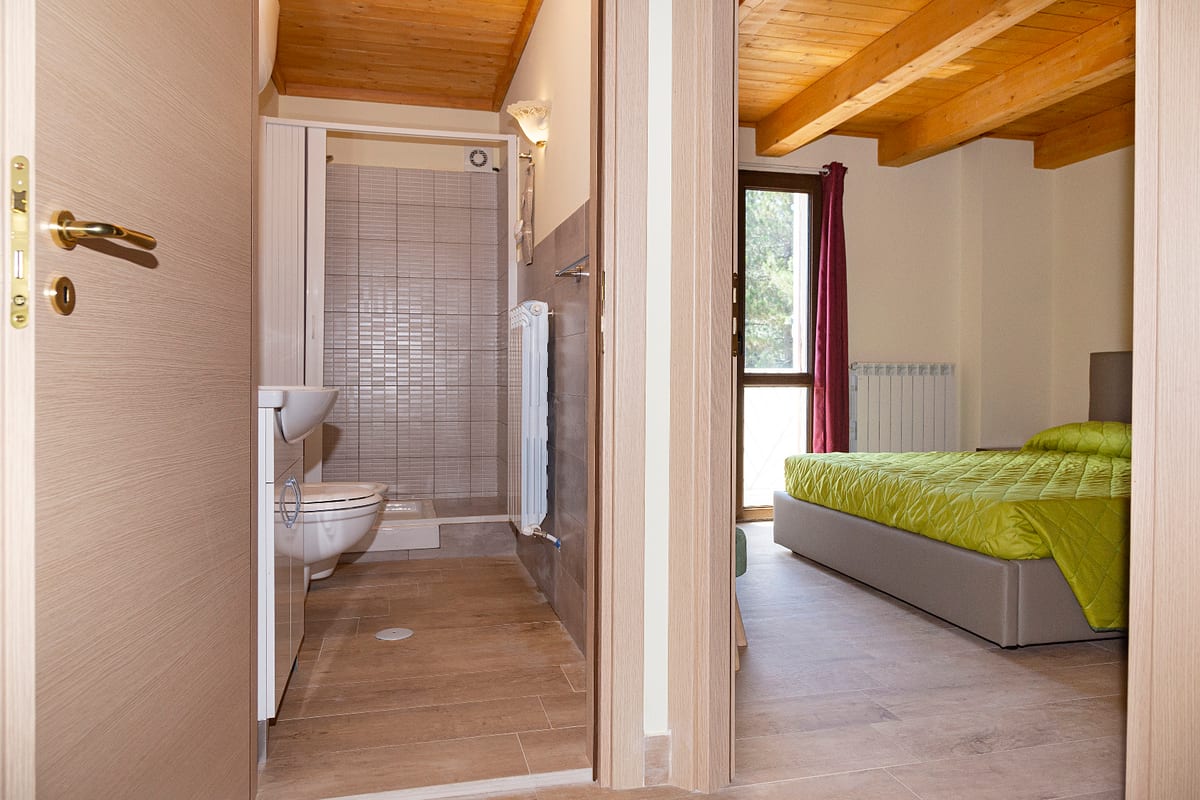 View towards bedroom with private bathroom