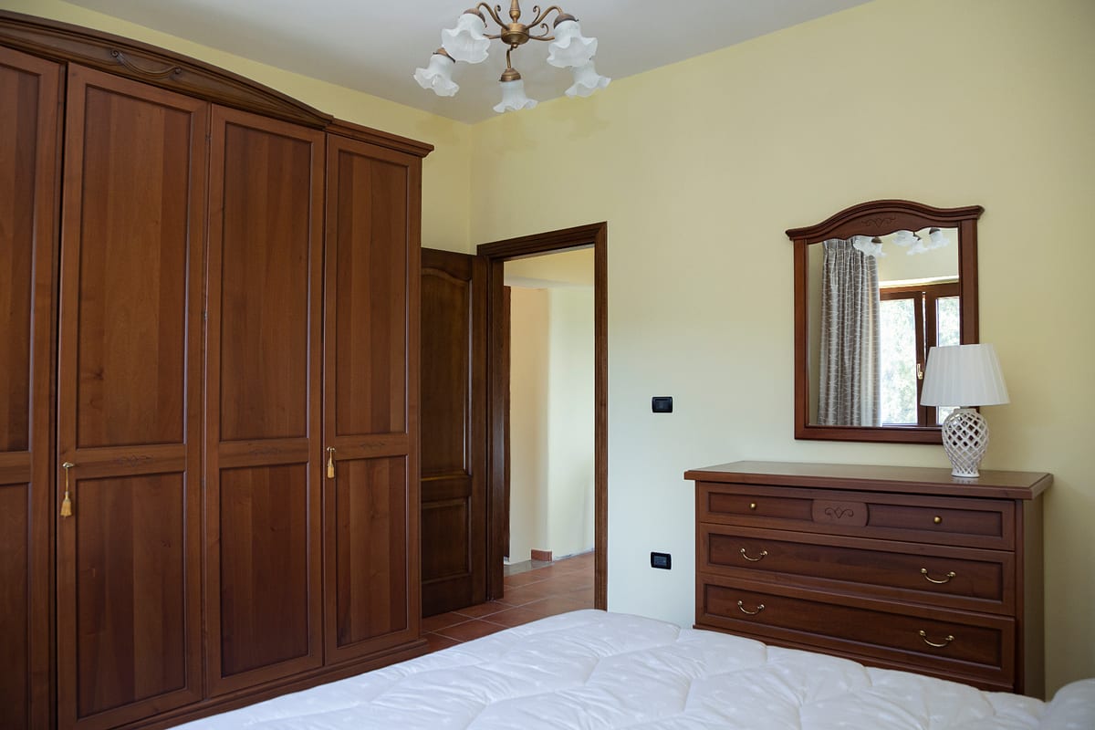 Bedroom with walnut wardrobe